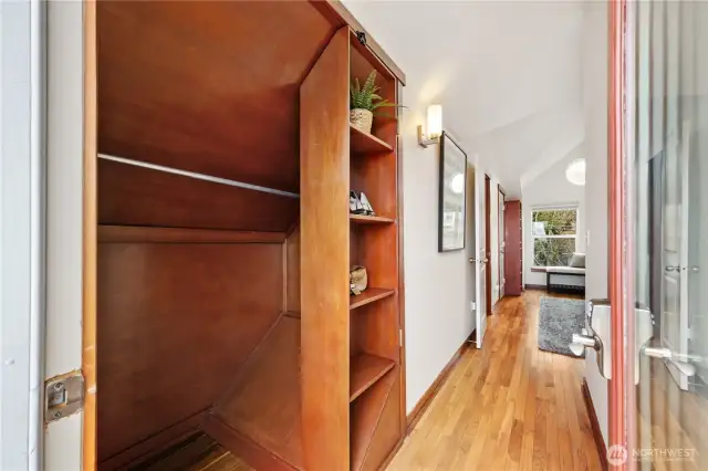 Primary bedroom closet #2 with custom swinging bookcase