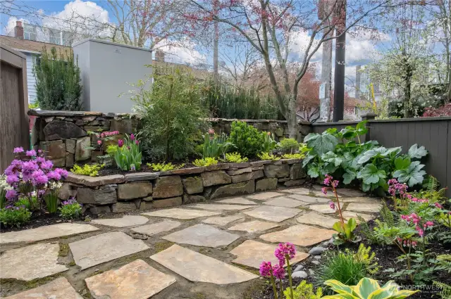 Stone patio and fully fenced garden space