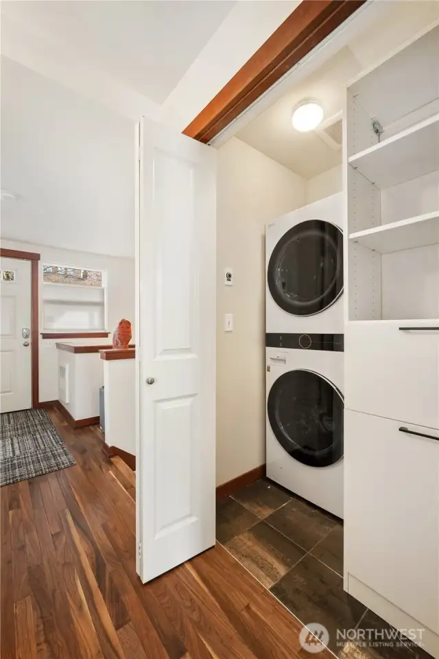 Entry hall with laundry closet and built-in shelving