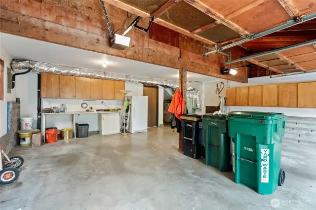 This 2-car garage does not disappoint. All kinds of room for parking and plenty or room for storage.