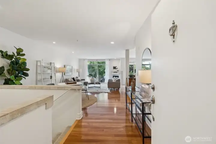 Main entry views to the open floorplan on  main and stairs down to the lower level