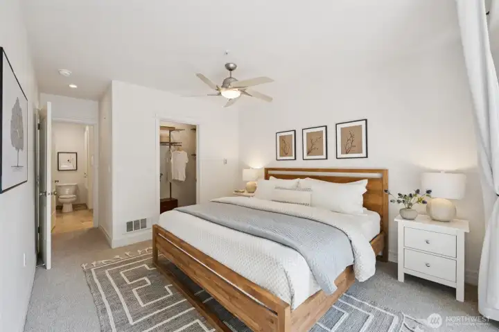 Primary bedroom with walk-in closet and full bathroom