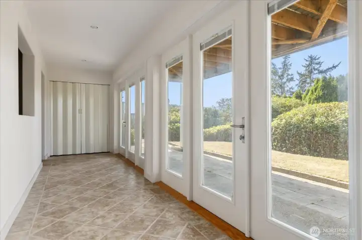 Wall of French doors, brings in tons of light.