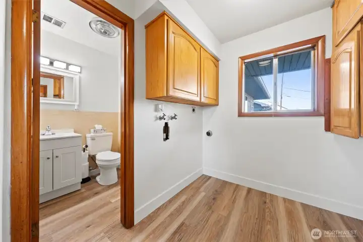 Laundry room opens to guest bathroom