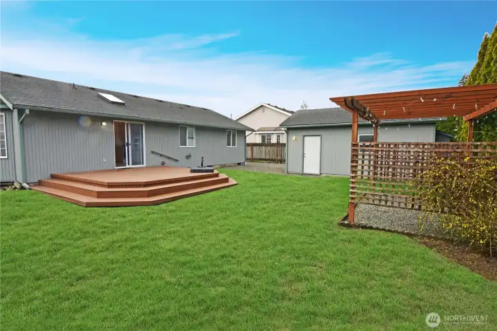 Enjoy a spacious fenced back yard with a large deck.