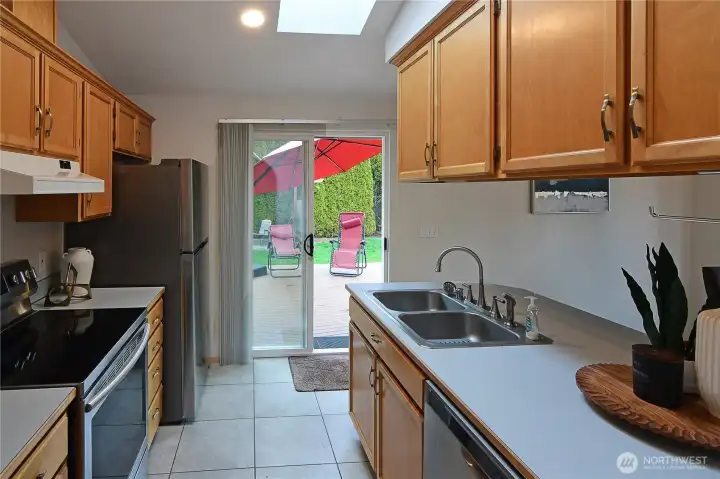 Functional galley kitchen with stainless appliances, generous cabinetry, and easy flow to the main living areas — well-maintained and move-in ready with inspection items largely completed.