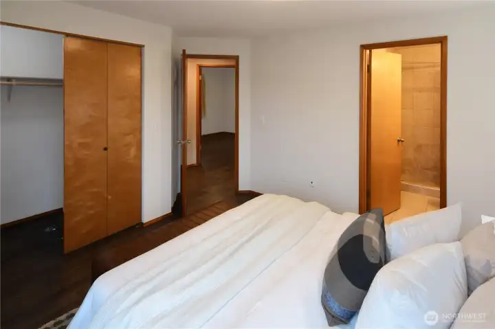 Comfortable primary bedroom with great natural light and easy single-level living — a perfect retreat in this well-maintained rambler. Ample closet space. The wood floors throughout the home are practical and easy to clean. Add you cosy rugs for warmth.