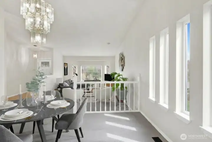 Dining room open to living room, virtually staged.
