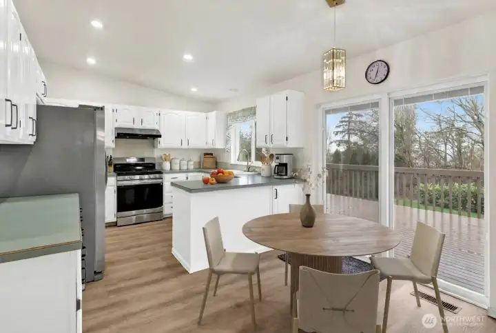 Virtually staged dining and kitchen.
