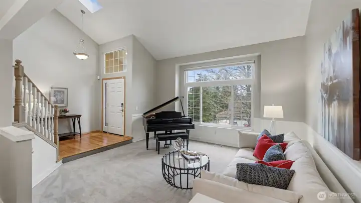 Spacious and light-filled living area awaits. Plenty of room, even for a baby grand.