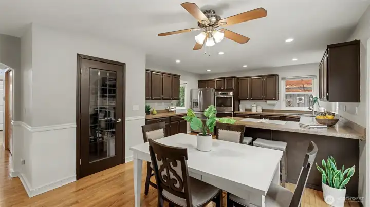 Stainless steel appliances, double oven, and large walk-in pantry add functionality to the space