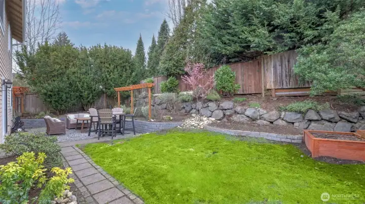 Landscaped backyard with room to garden, play, and relax