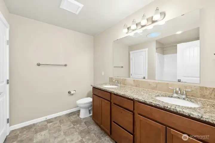 Hallway bathroom with large closet.