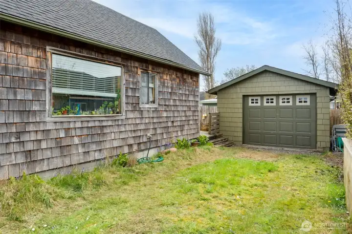 space for parking and a detached single car garage in the back.