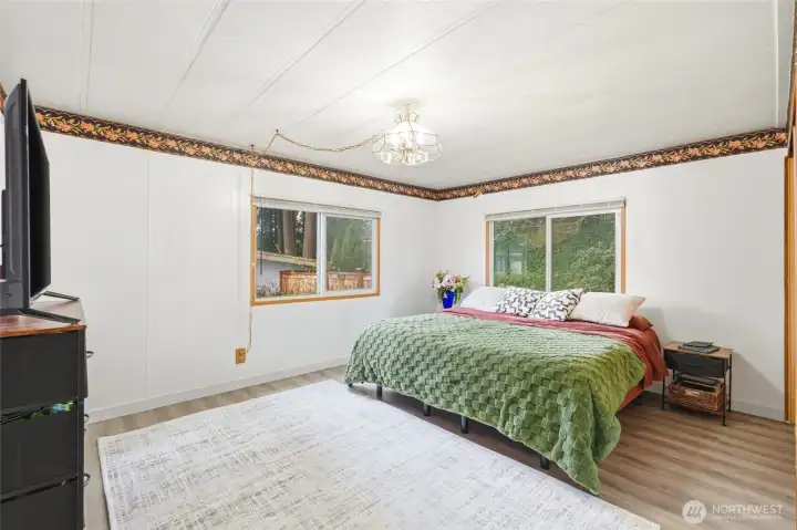 Spacious primary bedroom with natural light