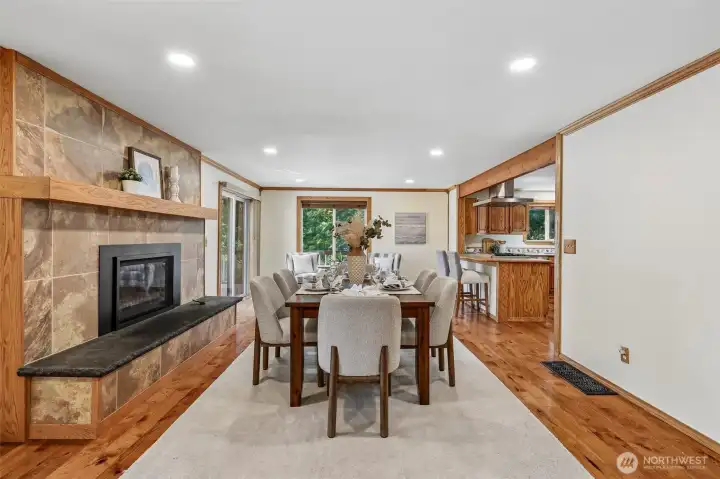 Another view of Dining Room with Kitchen on the right and large deck on the left.