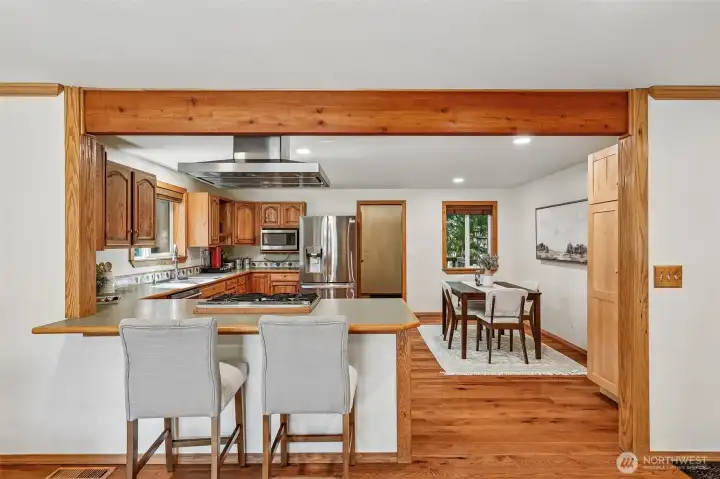 View of Kitchen, with Kitchen-eating space or countertop, from Dining Room.