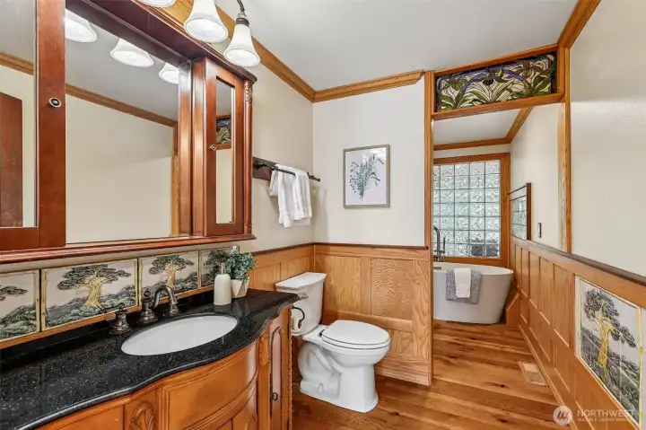 Main level Bathroom with Tiled art work throughout.