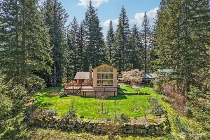 Panoramic view of House guarded by trees.