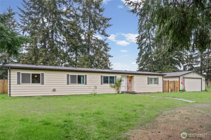 3 beds / 2 baths - 1,440 sq ft home with a 750+sq ft detached shop/garage on a fully fenced 1 acre lot.