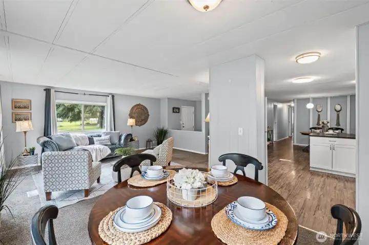 The living, dining, and kitchen have a nice flow allowing ease of meals or snacks while watching TV.