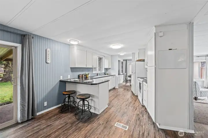 The formal dining is on the right of the kitchen and this end is the informal dining area.