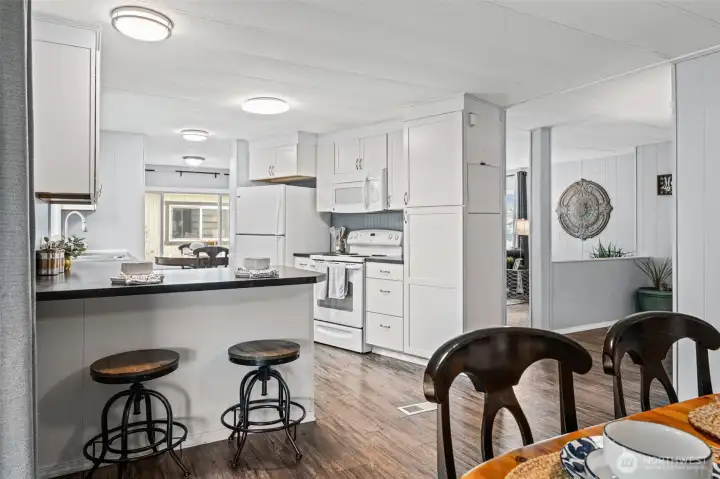 Additional seating at the kitchen peninsula.