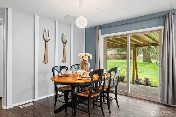 Sliding doors to your covered back patio and expansive fully-fenced yard.