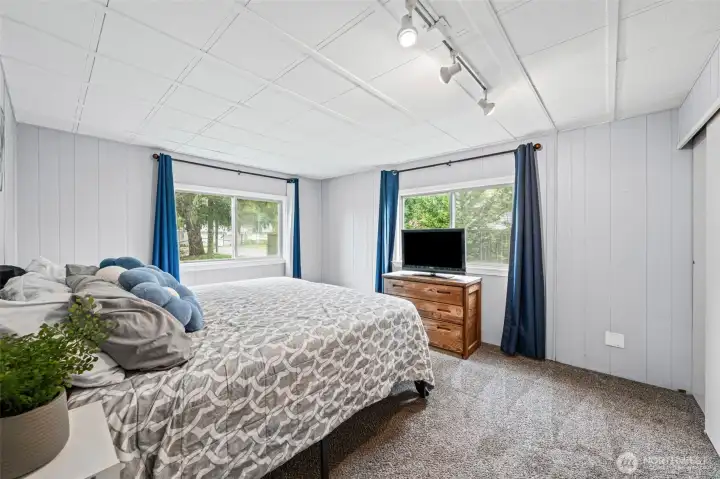 The primary bedroom.  Windows look out to the front and side yards.