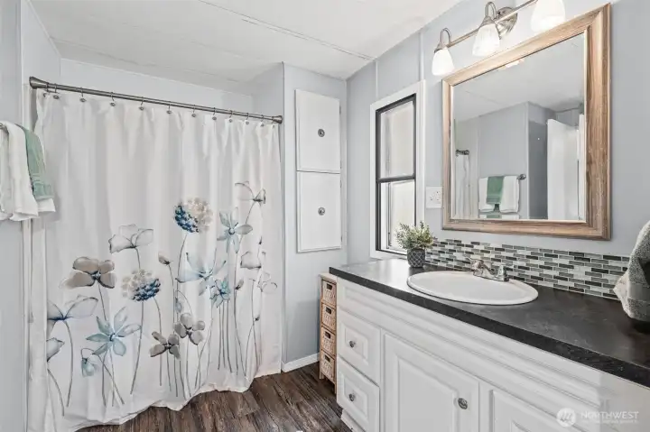 Primary bathroom with tub/shower combo.