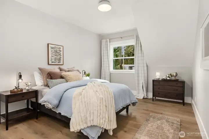 2nd bedroom upstairs with views to the SE of the water