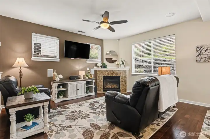 The great room has a cozy gas fireplace and tall 9' ceilings.