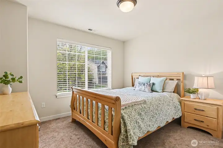 One of four spacious bedrooms.