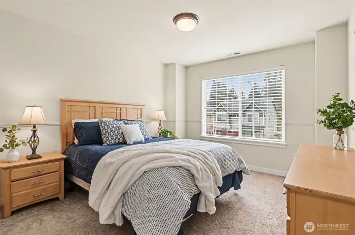 One of four spacious bedrooms with a walk-in closet.