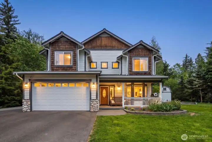Ravensdale acreage home on 1.22 acres with a covered front porch, attached 2-car garage, and a private setting surrounded by mature evergreens.    Ravensdale acreage home on 1.22 acres with a covered front porch, attached 2-car garage, and a private setting surrounded by mature evergreens.