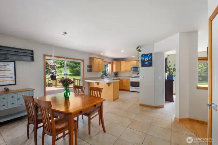 Open dining area with backyard views and direct access to the rear deck, creating an easy connection between indoor and outdoor living in this Ravensdale home.