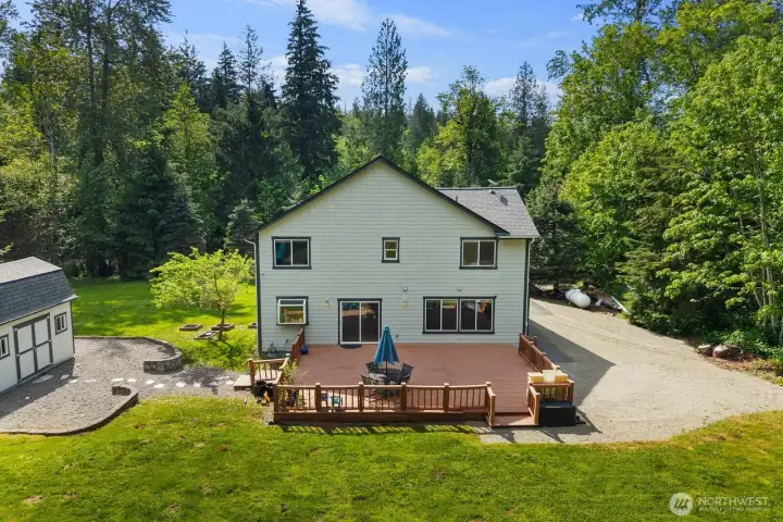Spacious backyard with room to play, garden, gather, or simply enjoy the outdoors. Complete with a detached shed, play structure, and open green space surrounded by towering evergreens, this property captures the feeling of Northwest living.