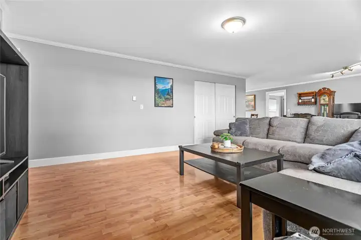 Living room with coat closet - looking back at the Primary #1 and dining