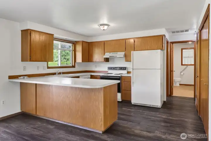 Functional and inviting, the kitchen offers plenty of workspace and a sink that overlooks the beautiful backyard, making meal prep a little more enjoyable. Enjoy peaceful views year-round from the heart of the home. Functional and inviting, the kitchen offers plenty of workspace and a sink that overlooks the beautiful backyard, making meal prep a little more enjoyable. Enjoy peaceful views year-round from the heart of the home.