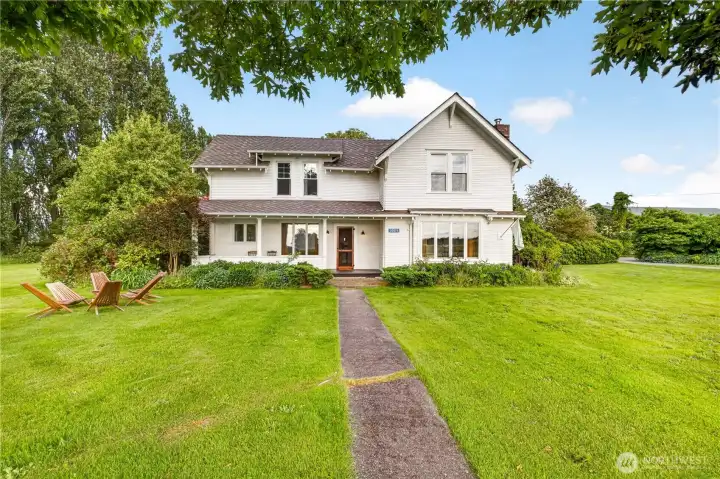 Step into timeless elegance with this beautifully preserved farmhouse, where classic architecture, a welcoming covered porch, and sweeping lawns create a truly storybook setting. Step into timeless elegance with this beautifully preserved farmhouse, where classic architecture, a welcoming covered porch, and sweeping lawns create a truly storybook setting.