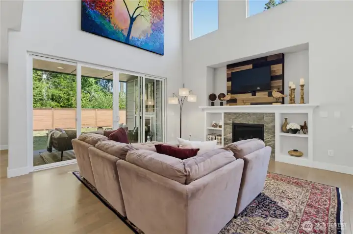 Designed for open, airy living with three doors that open to the covered patio. Designed for open, airy living with three doors that open to the covered patio.