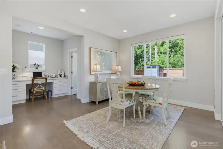 Dining room is open to the GREATROOM and pictured to the right is the sizeable pantry, built-in desk center and left is the entrance to the garage. Super functional floor plan. Dining room is open to the GREATROOM and pictured to the right is the sizeable pantry, built-in desk center and left is the entrance to the garage. Super functional floor plan.