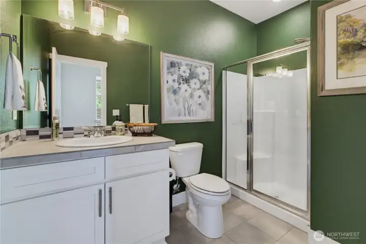 This is the spacious main floor bathroom with shower. This is the spacious main floor bathroom with shower.