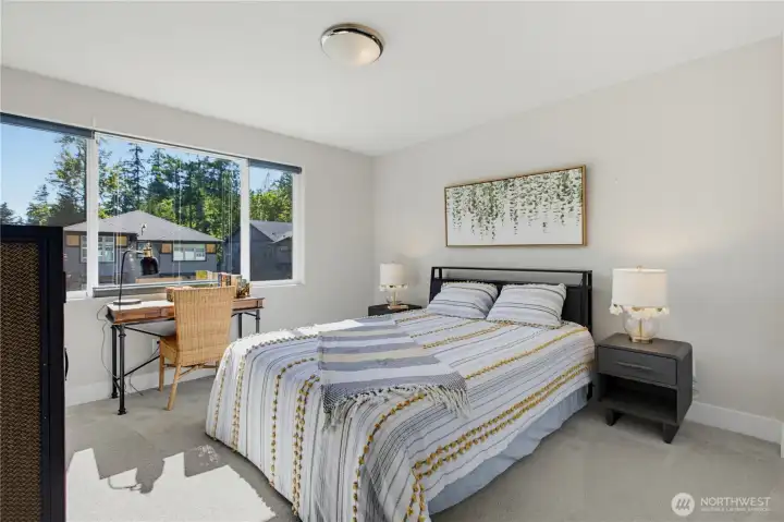 This bedroom looks over the front of the house. This bedroom looks over the front of the house.