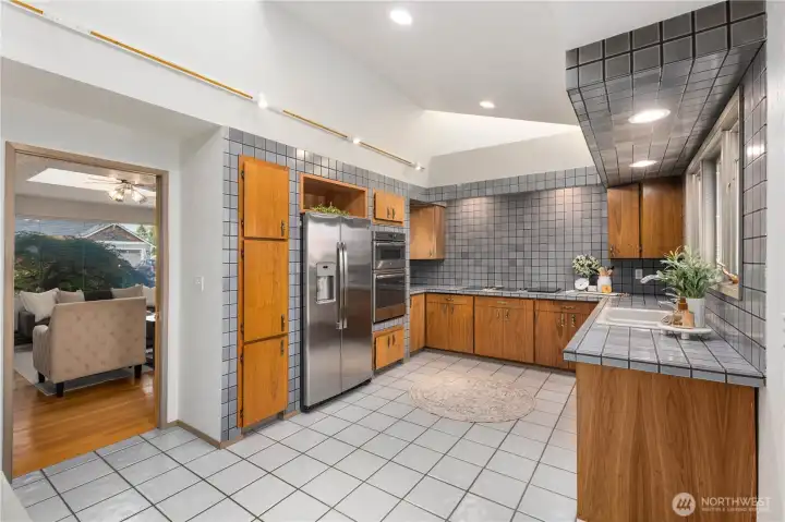 This Custom Tiled Kitchen also features a Jenn-Air Cooktop This Custom Tiled Kitchen also features a Jenn-Air Cooktop