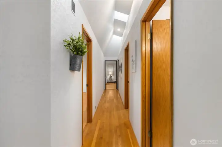 Vaulted Hallway Ceiling, Center Skylight is Manual Opening to let in fresh air Vaulted Hallway Ceiling, Center Skylight is Manual Opening to let in fresh air
