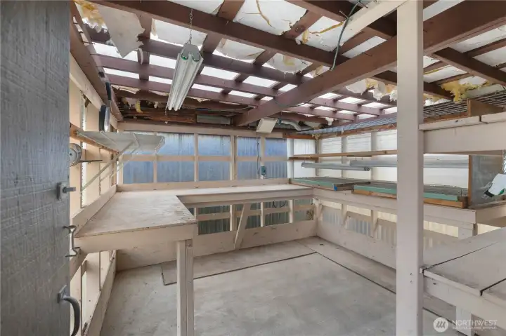 Inside the greenhouse there is a concrete slab floor Inside the greenhouse there is a concrete slab floor