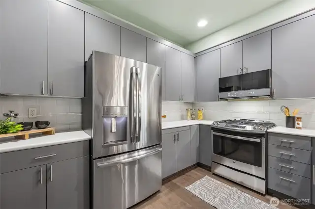 Cooks will appreciate the stainless-steel appliances & sleek cabinetry.