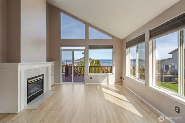 Facing spectacular sunrise views! Built in shelves to the right of the fireplace.