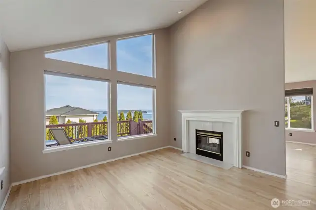 2-sided fireplace divides the 2 living spaces.